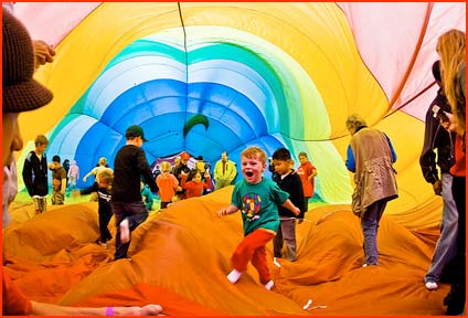 Kids play inside a hot air balloon