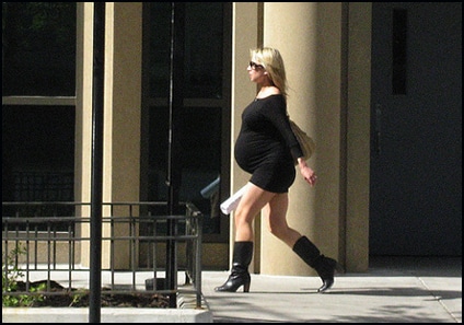 a very pregnant blond woman