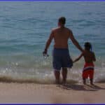 father and son on beach