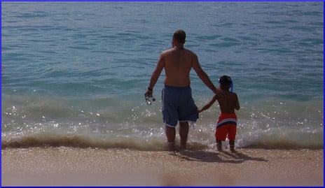 father and son on beach