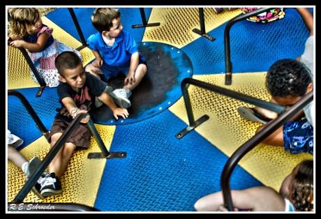children on park merry-go-round
