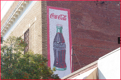 Coca-Cola ad on side of wall