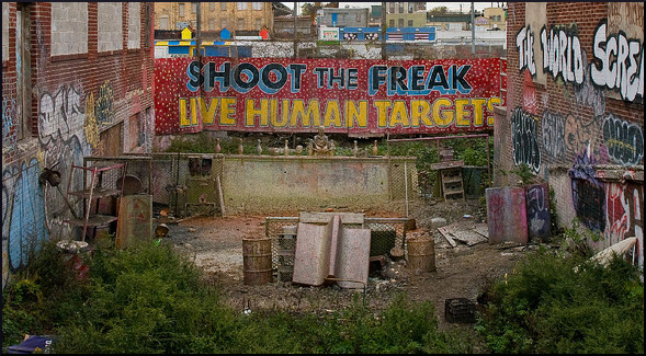 old sideshow sign: "shoot the freak, live human targets"
