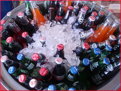 cooler of soda pop bottles