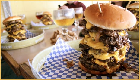 [cheeseburgers stacked with five or six patties]