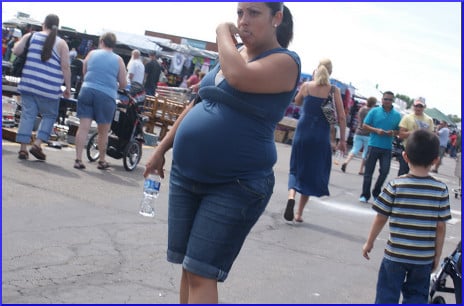 pregnant flea market attender