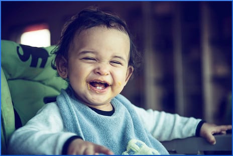 kid-in-high-chair-laughing