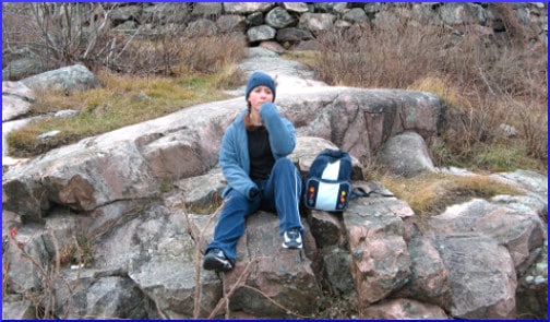 girl-reflecting-sitting-on-rock