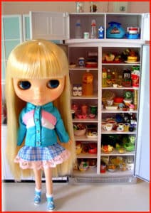 Priscilla-Ann showing you the refrigerator